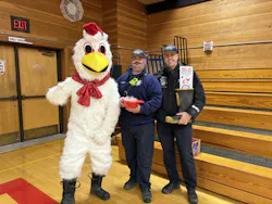 Corbett Fire Chief Rick Wunsch, firefighter Jeffery Corrigan and pose with the Christmas Chicken at the Corbett high school assembly. Corbett Fire Chief Rick Wunsch, firefighter Jeffery Corrigan and pose with the Christmas Chicken at the Corbett high school assembly.