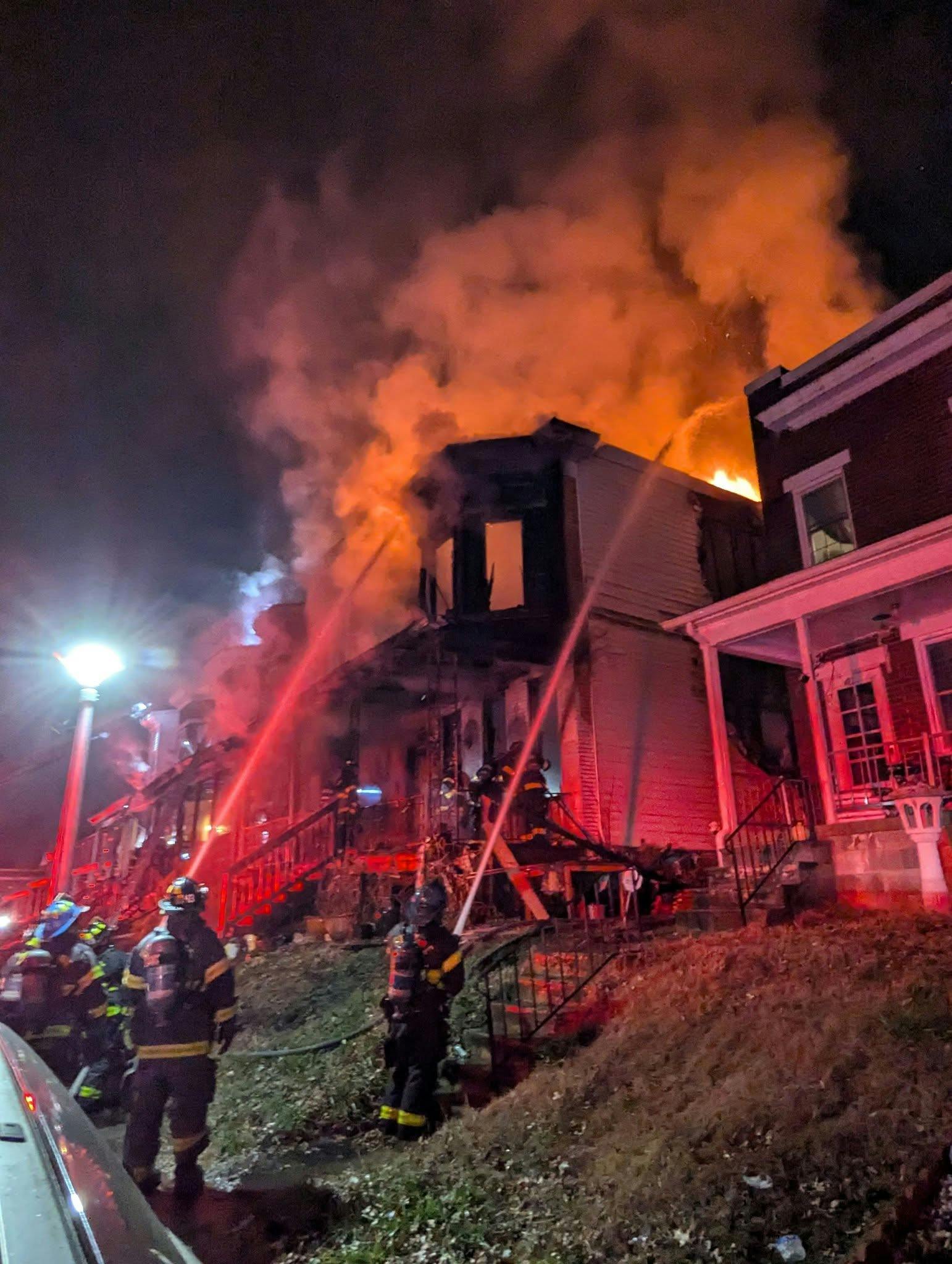Baltimore firefighters battled a fatal row house fire Friday morning.
