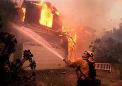 A firefighter battles a house fire in Pacific Palisades earlier this month. A firefighter battles a house fire in Pacific Palisades earlier this month.