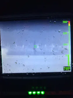 A TIC identifies a power line that’s arcing into the trees behind a structure: the white area in the tree to the right of the temperature measurement square. A TIC identifies a power line that’s arcing into the trees behind a structure: the white area in the tree to the right of the temperature measurement square.