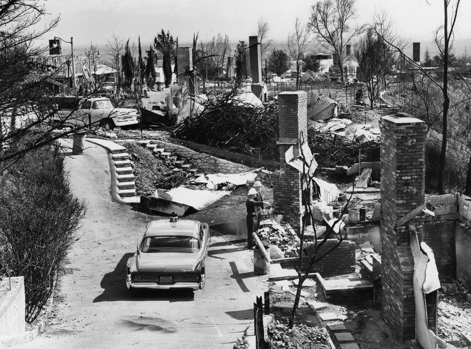 In 1962, a wildfire caused widespread destruction in Los Angeles. Los Angeles, CA - February 26, 1962 , Ruins along Somera Rd. area of complete destruction (