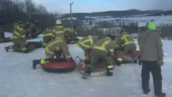 Teams gathered in inner tubes and raced downhill. Teams gathered in inner tubes and raced downhill.