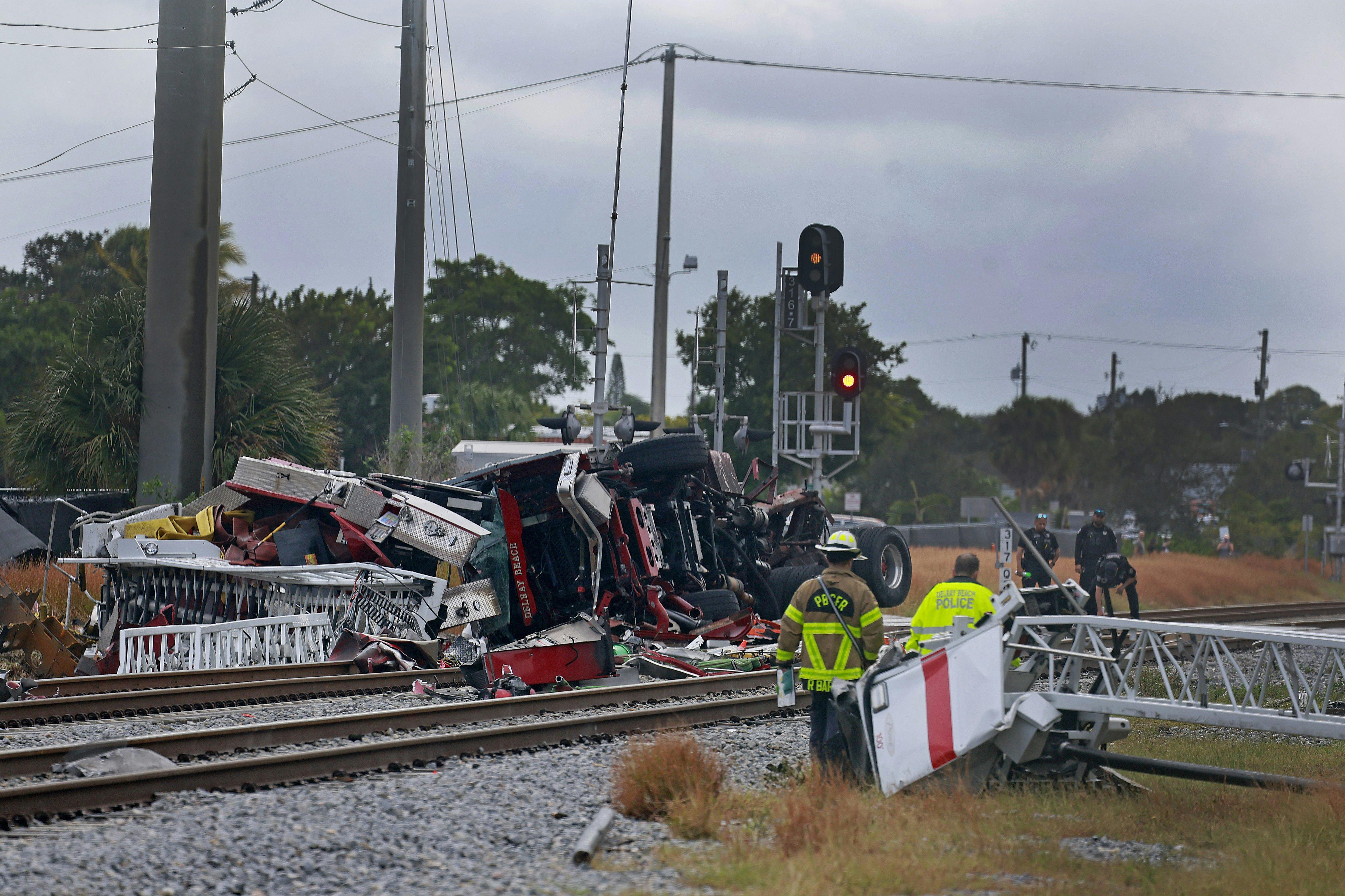 A Delray Beach ladder truck was hit by a train when the driver drove around the gates.