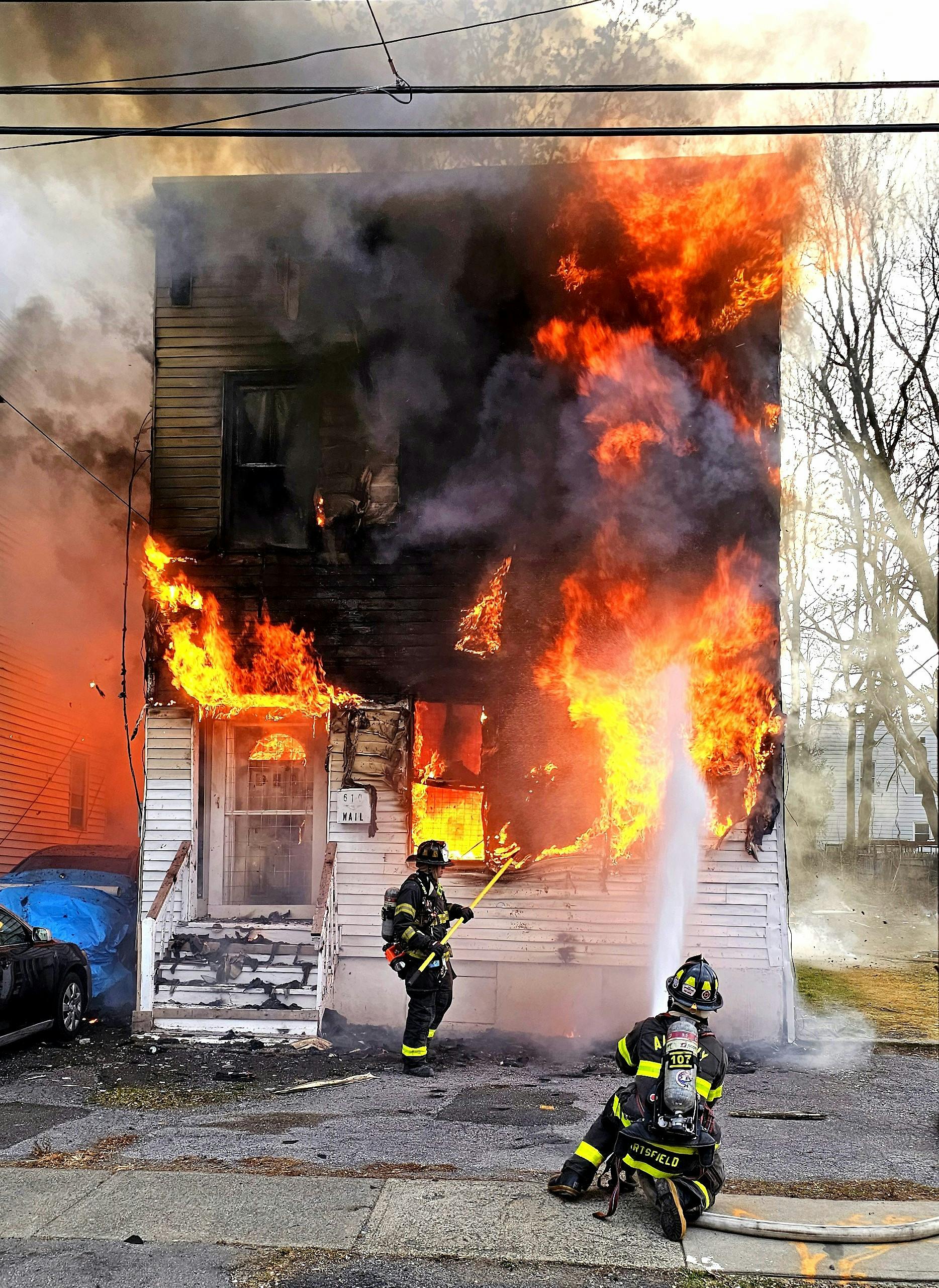 Members of the Albany, NY, Fire Department responded for a reported structure fire with occupants jumping from the structure. First-arriving units found a vacant building well involved, with fire rapidly extending into the B-side exposure. A second alarm was transmitted. Multiple lines were deployed, and a search of the original fire building was initiated. Companies contended with high winds, bitterly cold temperatures and burning overhead live electrical wires. Approximately 50 firefighters and 13 apparatus were on scene. A squatter who jumped from the vacant building wasn&rsquo;t located.