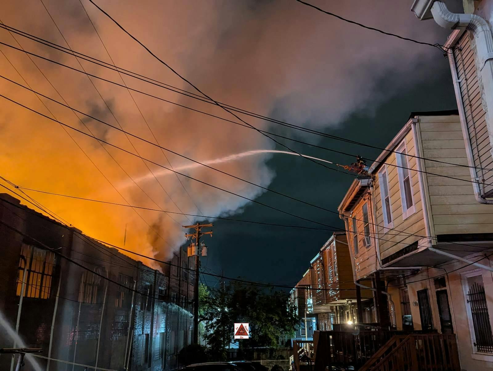 Fire engulfed a mattress warehouse in Baltimore.