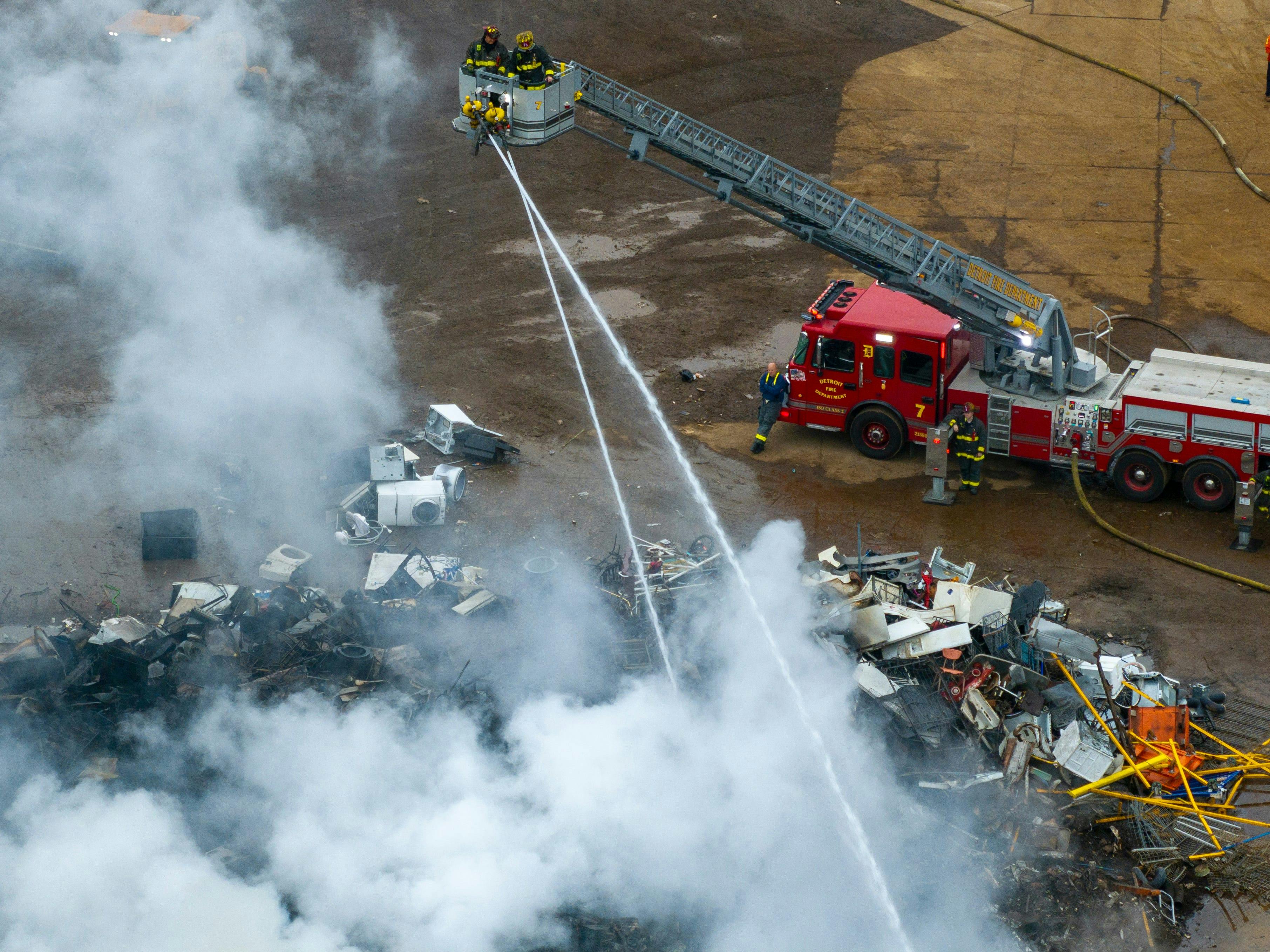 Detroit firefighters operate at scrap yard fire.