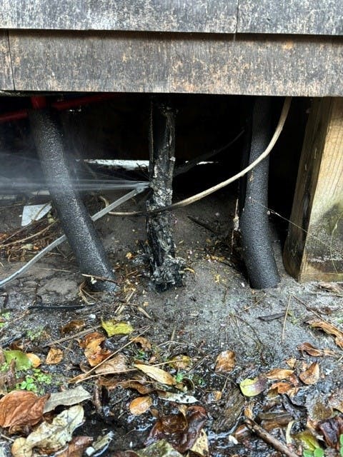 The completely fried middle pipe was the result of a power line coming down and onto a metal fence, grounding through heat tape all of the way to the water main.