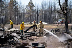 Firefighters Joshua Donahue, Chris Schlosser, Jon Settergren and Michael Hemmerich, left to right, move debris as they combat the Camp House wildfire in Brimson, MN last month. Firefighters Joshua Donahue, Chris Schlosser, Jon Settergren and Michael Hemmerich, left to right, move debris as they combat the Camp House wildfire in Brimson, MN last month.