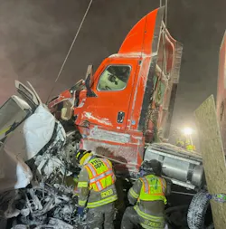 This semitrailer cab was lifted by a rotator that was positioned on an overpass above the scene. This allowed rescuers to tunnel into a van and rescue two people following a pileup on the Ohio Turnpike. This semitrailer cab was lifted by a rotator that was positioned on an overpass above the scene. This allowed rescuers to tunnel into a van and rescue two people following a pileup on the Ohio Turnpike.