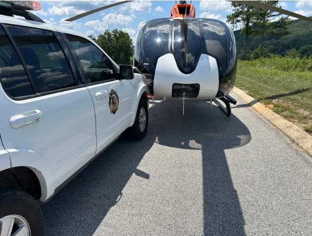 A new helicopter was hit by an SUV at a crash scene.