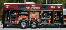 PGFD Rescue Squad 820 carries an assortment of hydraulic rescue tools on each of its sides, along with shoring and stabilization tools, portable lighting and multiple power saws. Note the web strapping that’s on the cribbing and the use of heavy-rated slide trays in certain compartments. PGFD Rescue Squad 820 carries an assortment of hydraulic rescue tools on each of its sides, along with shoring and stabilization tools, portable lighting and multiple power saws. Note the web strapping that’s on the cribbing and the use of heavy-rated slide trays in certain compartments.