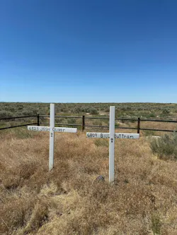 Two white crosses that are part of the Point Fire Memorial, seven miles south of Kuna, stand in stark contrast to the brown desert landscape. They mark the spot where Kuna firefighters Bill Buttram and Josh Oliver were killed on July 28, 1995. Two white crosses that are part of the Point Fire Memorial, seven miles south of Kuna, stand in stark contrast to the brown desert landscape. They mark the spot where Kuna firefighters Bill Buttram and Josh Oliver were killed on July 28, 1995.