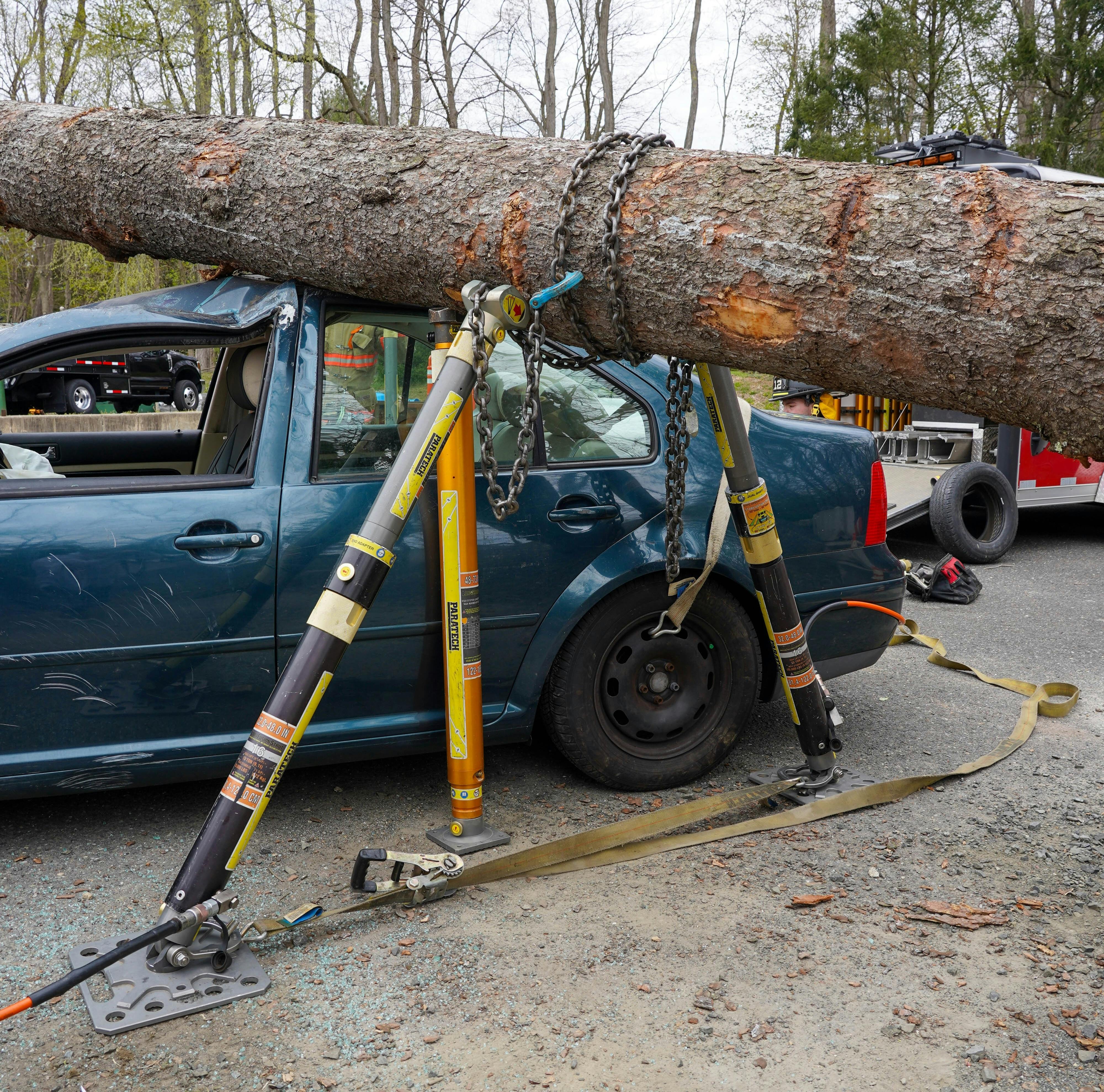 A tree that&rsquo;s on the roof of a car that&rsquo;s on its four wheels initially might not seem like anything special or unique. However, the tree itself is full of concerns to consider. The round shape of the tree trunk creates the issue in which it can roll in either direction off of the roof. Where the tree landed can influence the thought process greatly. Is it at the midpoint of the tree, to the extent that it&rsquo;s teetering in the center? Is only one end of it on the vehicle? How is it stabilized? Can a strut be used, or is it best to set up a chain basket in coordination with the struts?
