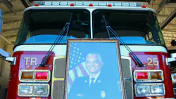 A portrait of the late Alexander G. Trenier sits on the front of a truck in the Mobile fire station that bears his name. A portrait of the late Alexander G. Trenier sits on the front of a truck in the Mobile fire station that bears his name.