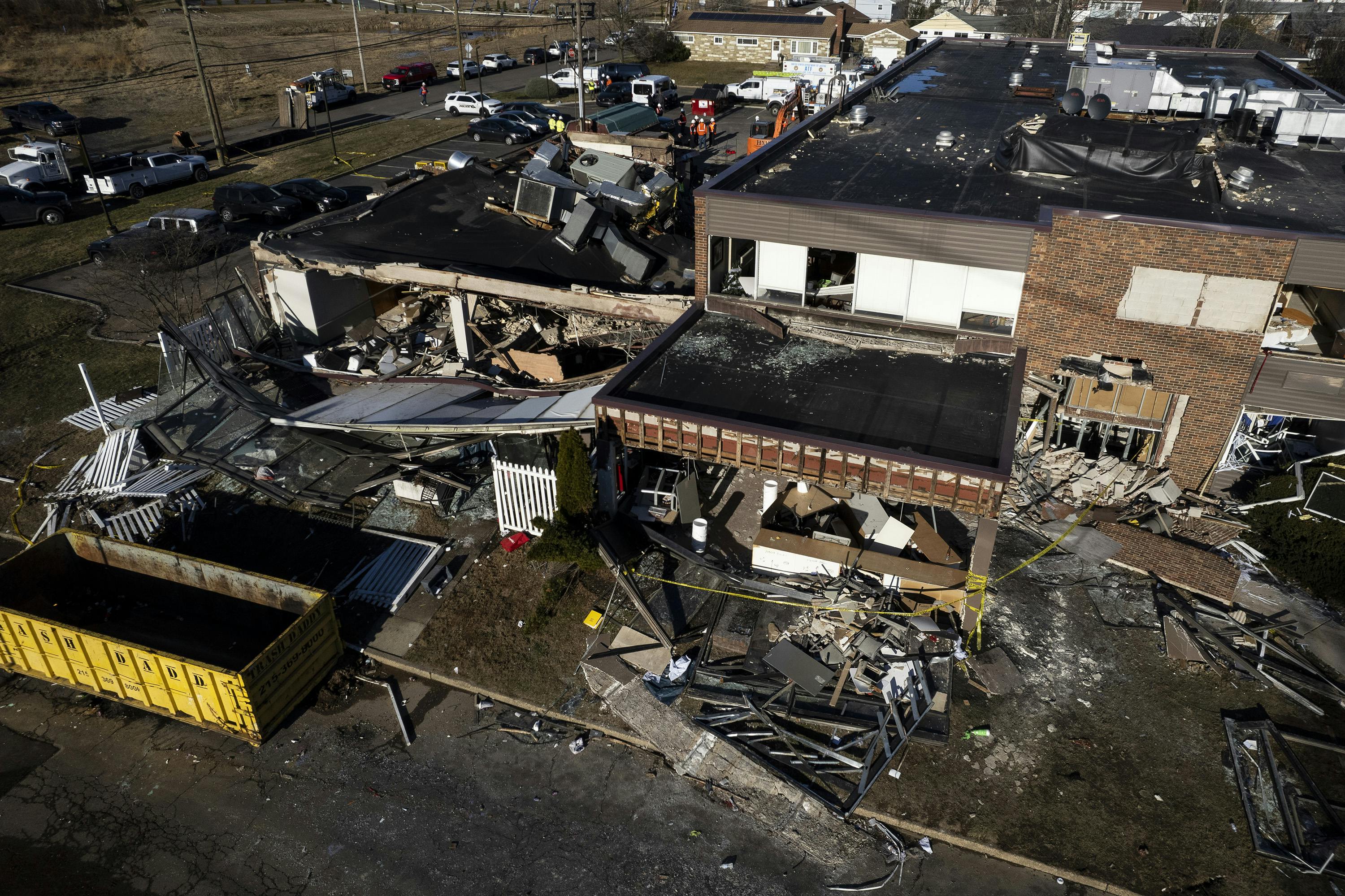 Investigators and emergency responders at Bristol Health & Rehab Center on Dec. 24, 2025, the day after an explosion left a nurse and patient dead.