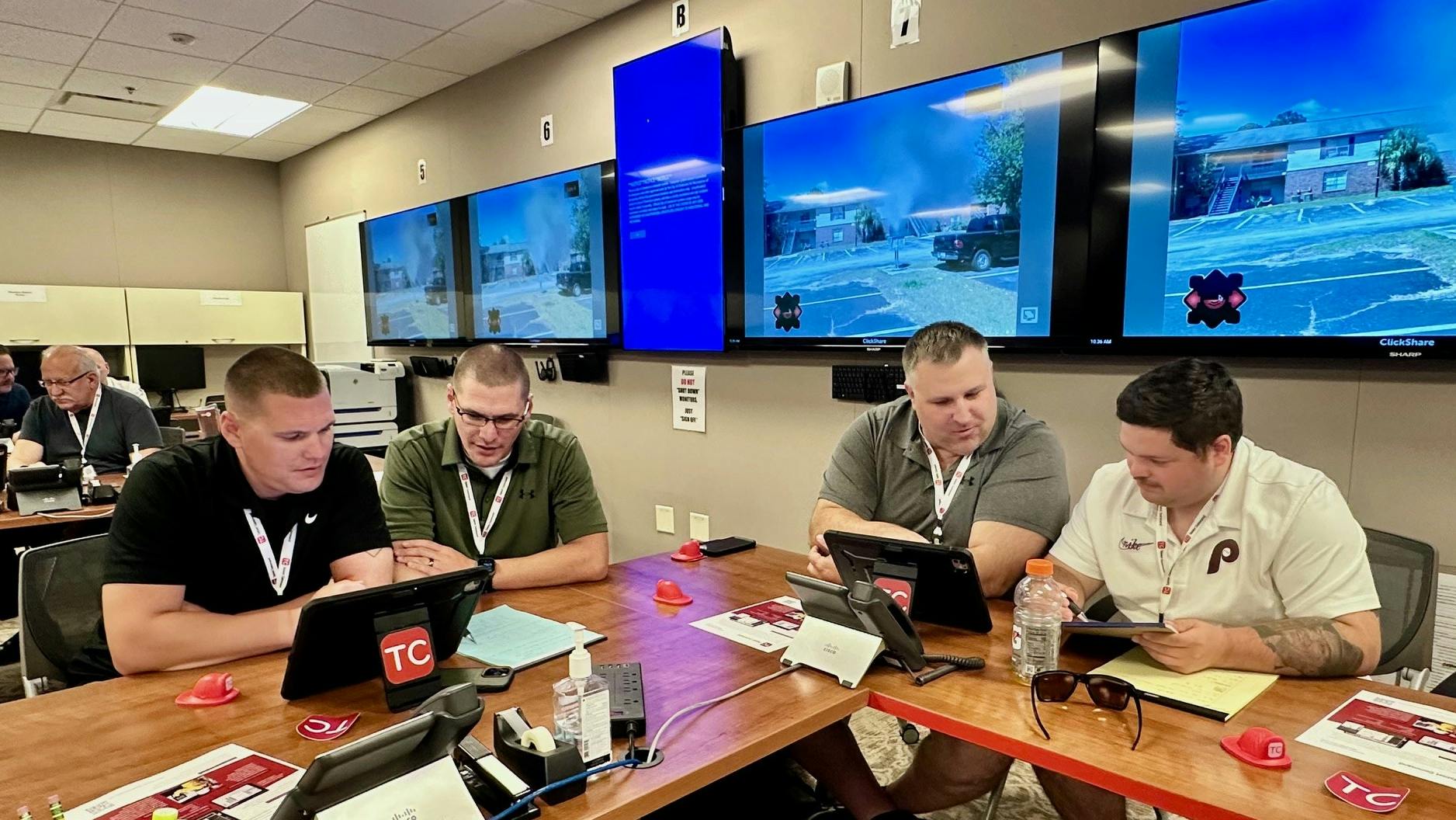 Firefighters take part in incident command training using both iPads and paper to learn how technology can assist. Improvements with virtual, augmented, and mixed-reality systems, combined with digital twins, are a convergence of technologies that offer the ability for firefighters to train.