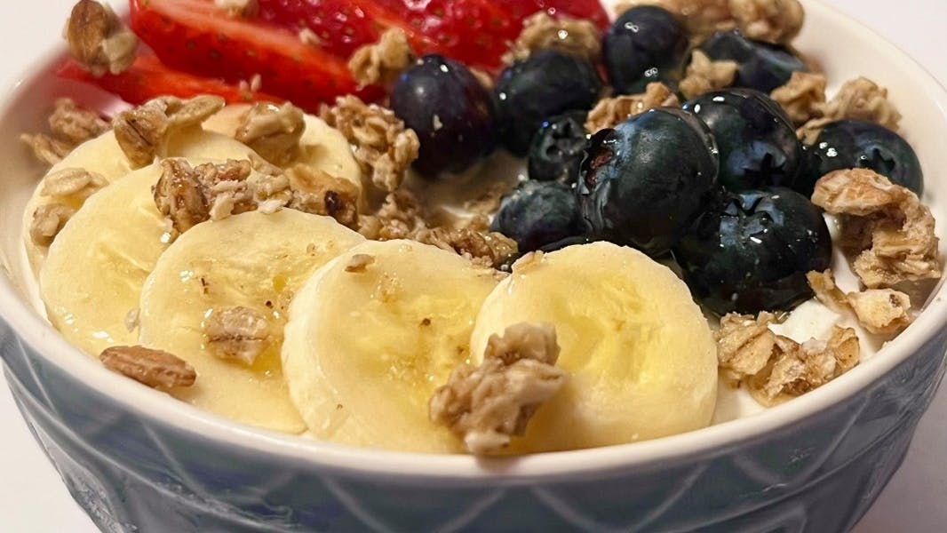 An example of a healthful breakfast is low-sugar yogurt, fresh fruit, granola and a drizzle of honey.