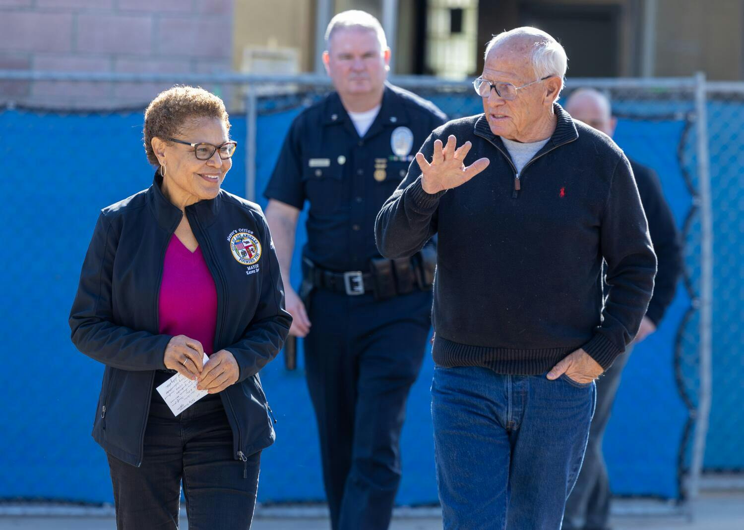 Mayor Karen Bass, left, and her disaster recovery czar Steve Soboroff, right, arrive at a press conference recently.