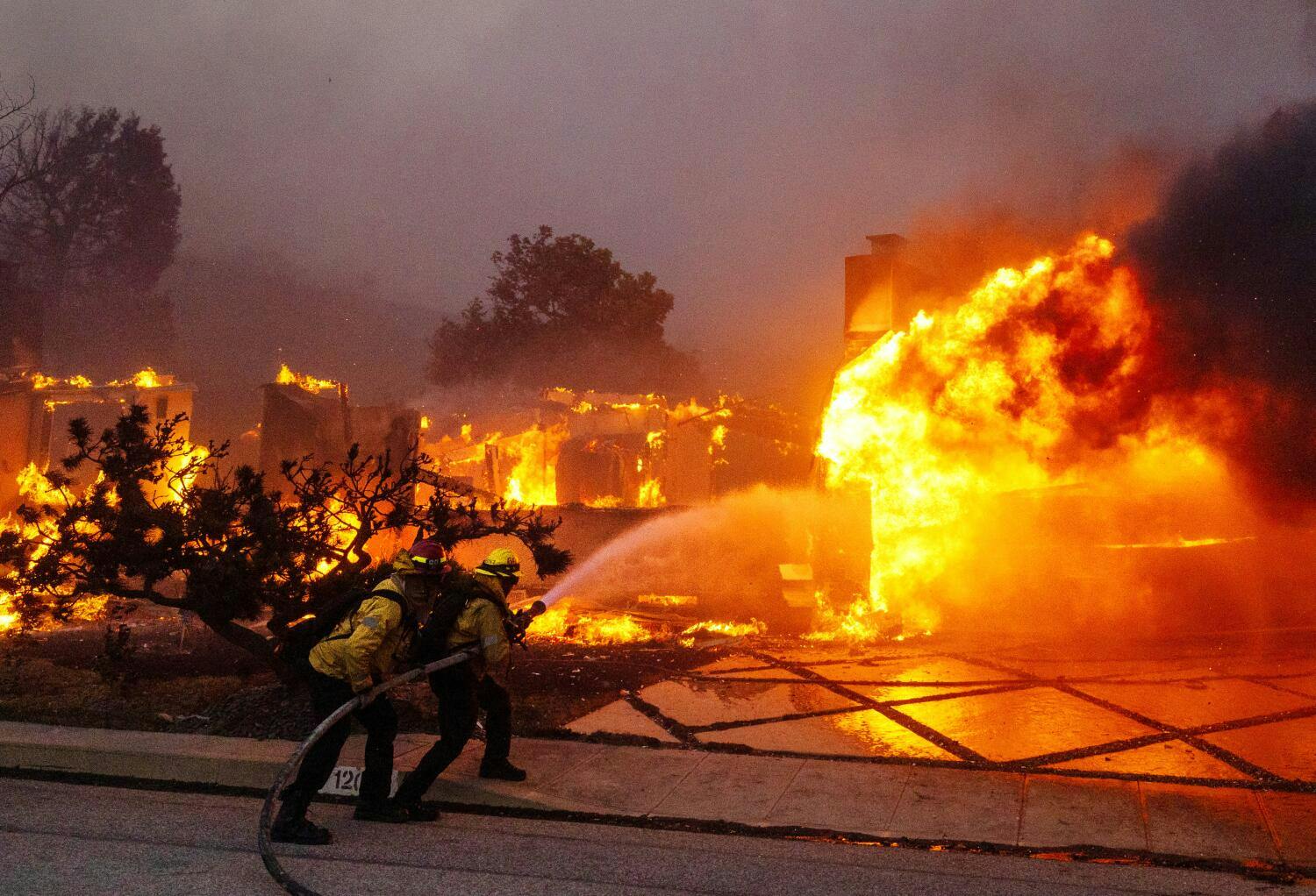 Firefighters battle the Palisades fire on El Medio Ave. on Tuesday, Jan. 7, 2025. California.