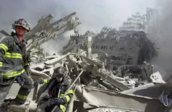 A firefighter searches the pile at the World Trade Center on Sept. 11, 2001. A firefighter searches the pile at the World Trade Center on Sept. 11, 2001.