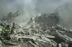 Firefighters search debris in the ruins of the World Trade Center on Sept. 12. Firefighters search debris in the ruins of the World Trade Center on Sept. 12.