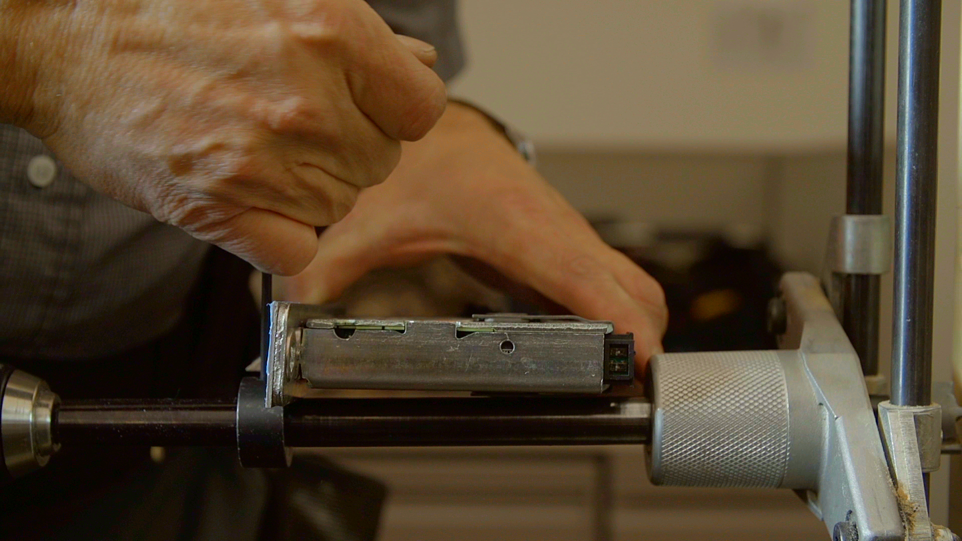 Photo 1. 2. Apply the INJIGC-MORT-CWB27 cutting bit, to the boring shaft, adjust depth to the lock body, and tighten depth collar to depth of the lock body