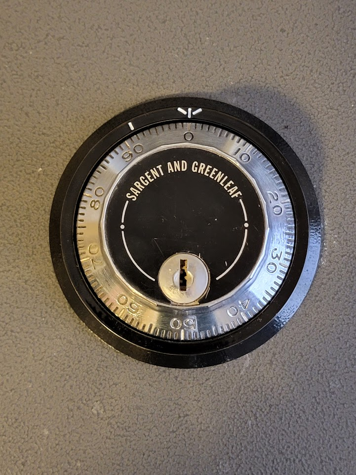 Image 1: The Sargent & Greenleaf three-wheel safe lock to be removed