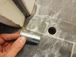 Photo 1. Installing a multi-point high security door receiver cup Photo 1. Installing a multi-point high security door receiver cup