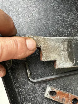 Bracket removed. You can see the hairline crack that could result in a door falling on someone if it broke. Bracket removed. You can see the hairline crack that could result in a door falling on someone if it broke.