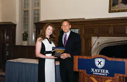 First Transit Director or Marketing Ashley McNamara was recognized as one of Xavier University's William College of Business Young Alums and presented the award by Dean Brian Till. First Transit Director or Marketing Ashley McNamara was recognized as one of Xavier University's William College of Business Young Alums and presented the award by Dean Brian Till.