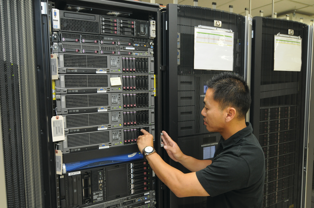 Senior Communications Systems Analyst Minh Nguyen works on a VTA server.