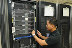 Senior Communications Systems Analyst Minh Nguyen works on a VTA server. Senior Communications Systems Analyst Minh Nguyen works on a VTA server.