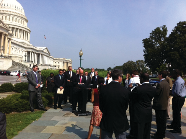 Bipartisan rally for transit benefit parity; at the podium is Rep. Jim McGovern and to his left, Rep. Michael Grimm.