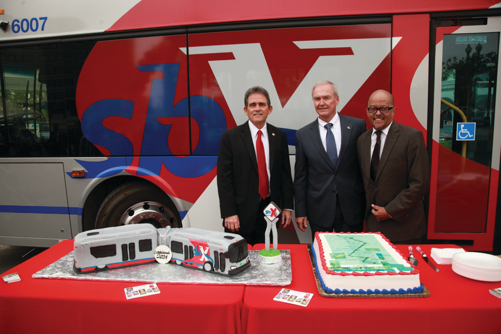 From left, San Bernardino Mayor Carey Davis and Omnitrans CEO Scott Graham join FTA Region IX Administrator Leslie Rogers at a ceremony celebrating the completion of the sbX BRT line.