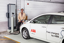 Ken Graber, director of media relations at ABB, charges the company&rsquo;s Nissan Leaf at the UWM quick-charge station in the Klotsche Center & Pavilion parking structure