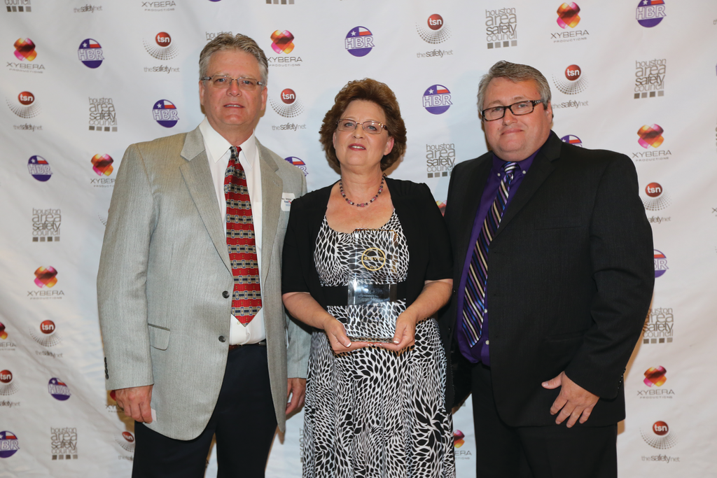 Photo, Left to Right, First Vehicle Services Exxon/Mobil Fleet Maintenance Team Members General Manager Bill Snowden Administrative Manager Donna Kelly Operations Manager Ed Martin