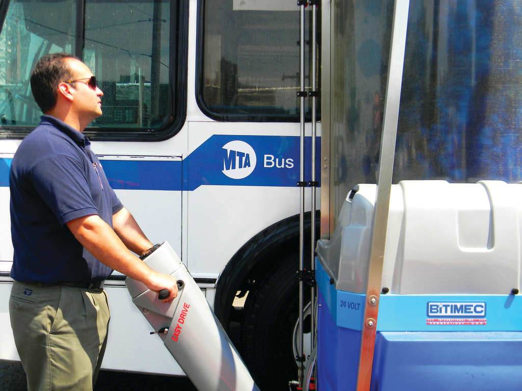 Bitimec Office Manager Christian Murillo demonstrates one of two 626-EZs installed at the 500-bus Eastchester depot of the New York Metropolitan Transportation Authority.