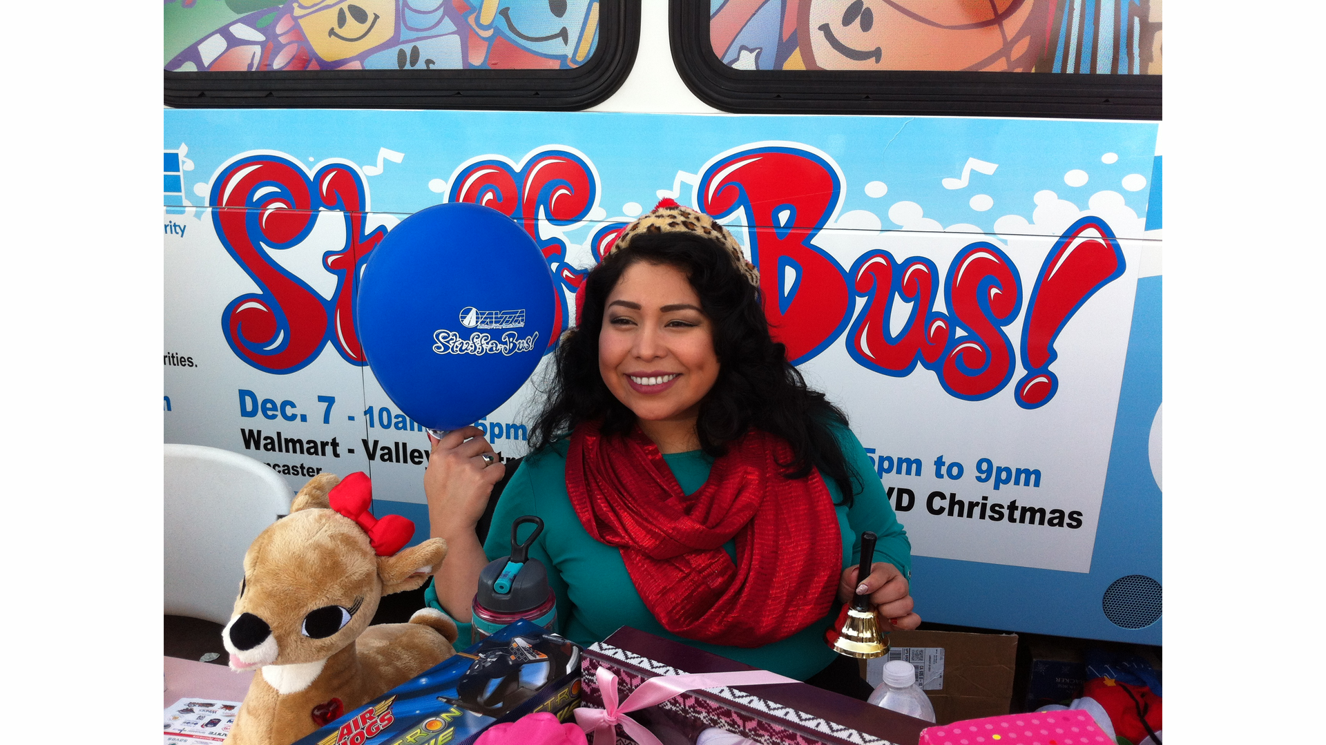 Volunteers are helping AVTA stuff the bus as part of its annual holiday drive to help the less fortunate.