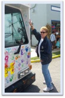 DASH General Manager Sandy Modell joins the painting fun.