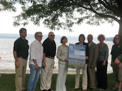 TCAT Acting General Manager Alice Eccleston, fourth from left, holds a Learn to Swim poster with Commissioner Rose Harvey, New York State Office of Parks, Recreation and Historic Preservation. TCAT Acting General Manager Alice Eccleston, fourth from left, holds a Learn to Swim poster with Commissioner Rose Harvey, New York State Office of Parks, Recreation and Historic Preservation.