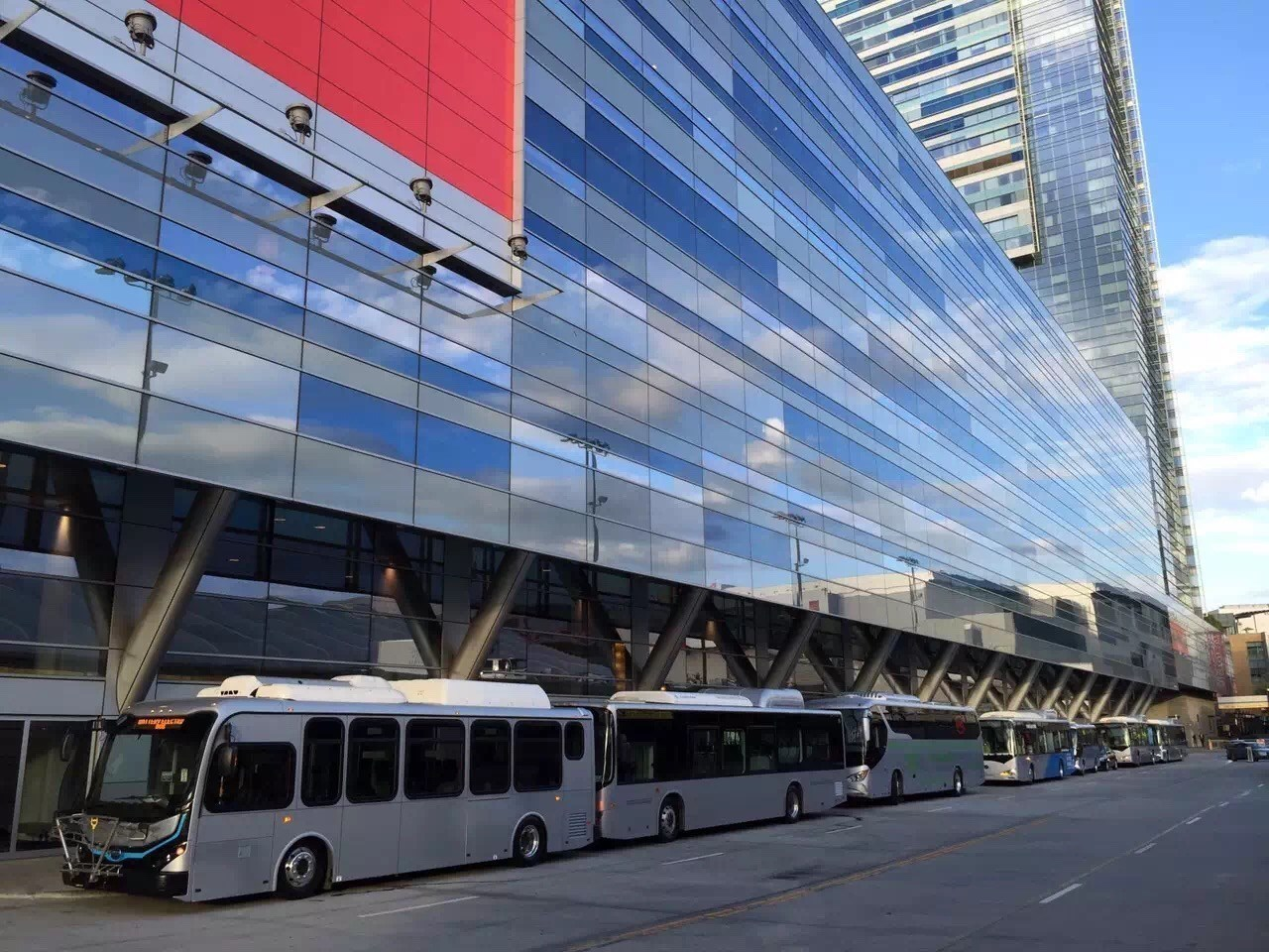 BYD buses line up outside the JW Marriott in Los Angeles.