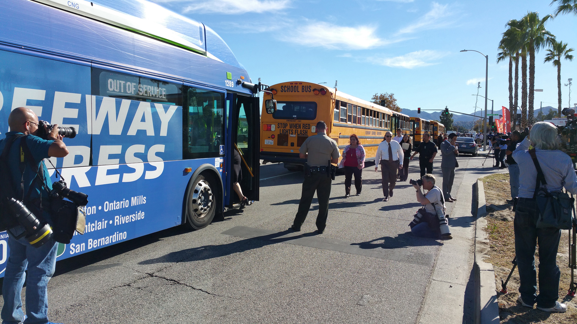People evacuated from Inland Regional Center board buses in aftermath of San Bernardino, California terrorist attack on Dec. 2.