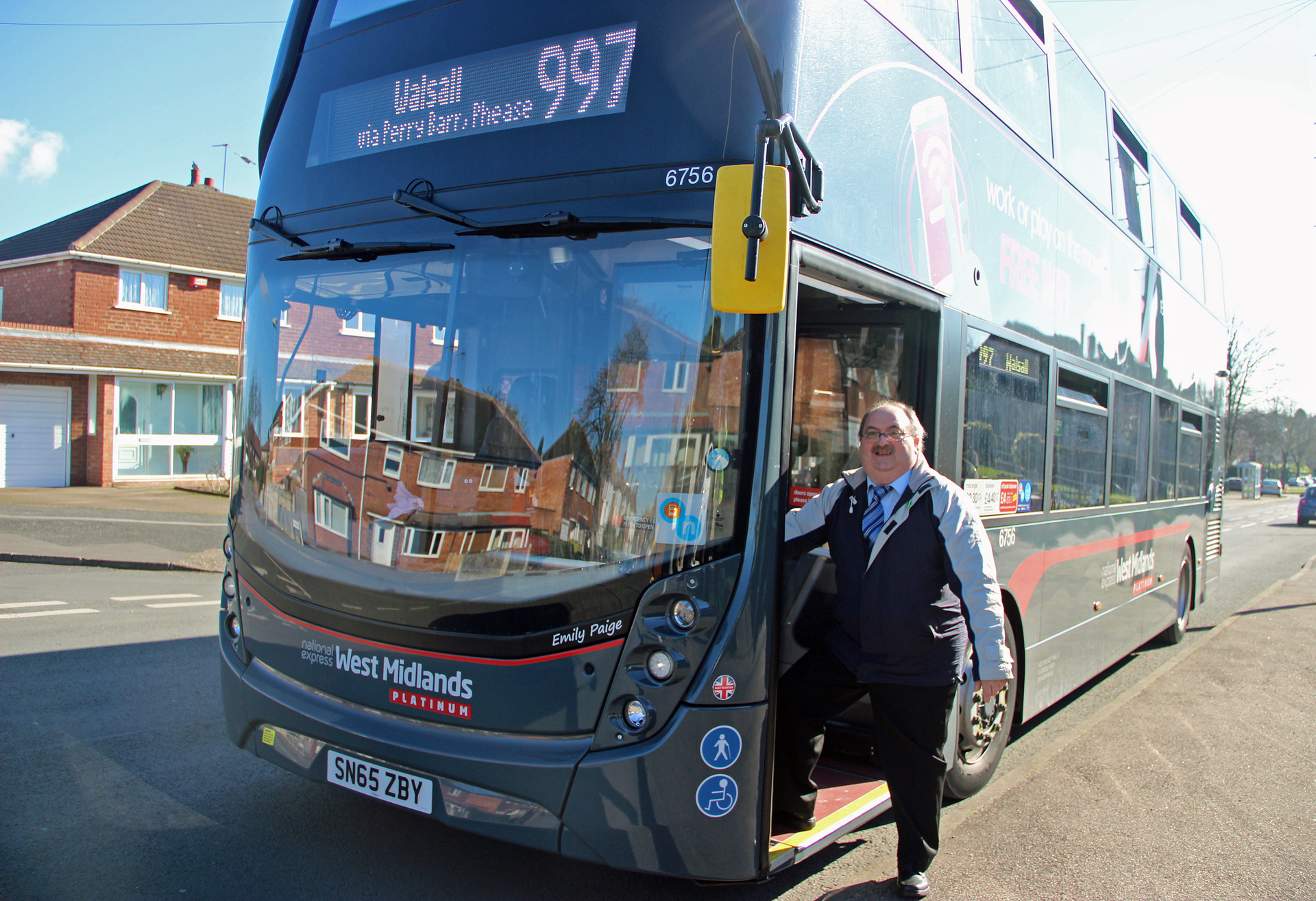 Birmingham City Councillor Keith Linnecor with a National Express Platinum bus.
