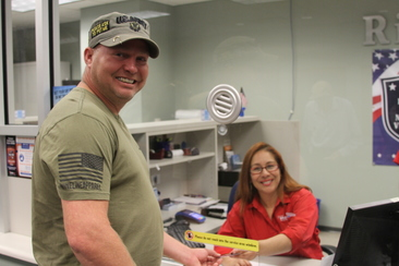 U.S. Army veteran Justin Marcum, Sr. receives his METRO Veterans Pass.