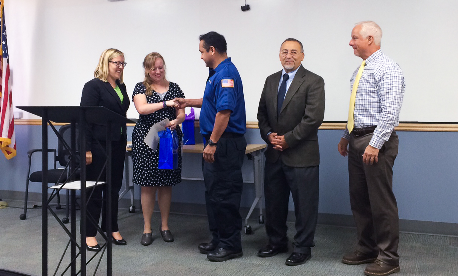 Committee on Accessible Transportation Chairperson Holly Ferrin honors bus operator Richard Montoya.