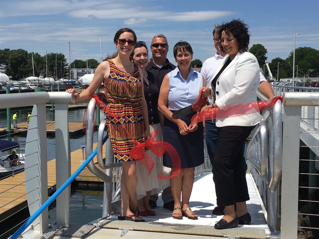 City of Salem Mayor Kim Driscoll cutting the ribbon at the Salem Water Shuttle launch ceremony on July 15, along with Ward 2 City Councilor Heather Famico, Principal and General Manager of Boston Harbor Cruises Alison Nolan, Deputy Director of Planning and Community Development Kathy Winn, Harbormaster Bill McHugh and Ward 7 City Councilor Steve Dibble.