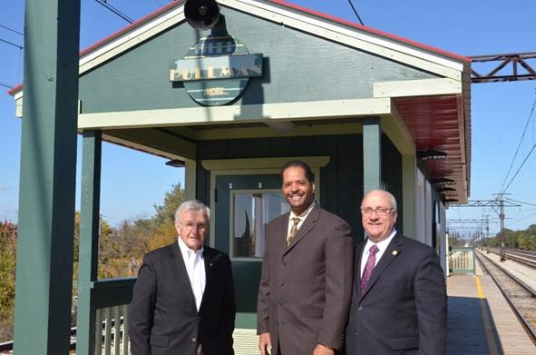 Historic Pullman Foundation President Michael Shymanski (from left), Ald. Anthony Beale (9th) and Metra Executive Director/CEO Don Orseno pose in front of the new warming house at the renovated 111th St./Pullman Station on the Metra Electric Line.