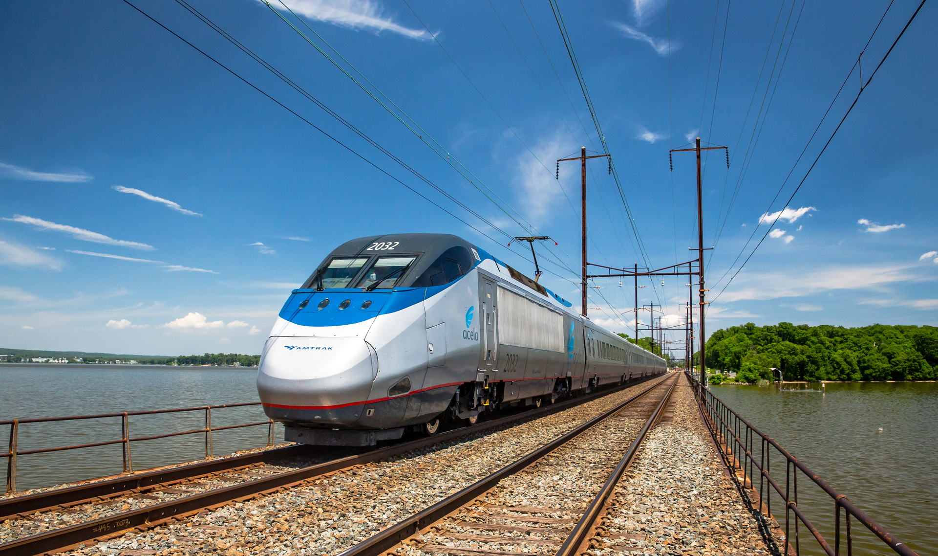 The Acela Express travels over the Bush River rail bridge in Maryland. The Acela Express offers hourly service downtown to downtown during peak morning and afternoon rush hours between New York, Washington, D.C., Baltimore, Philadelphia and other intermediate cities, as well as many convenient round-trips between New York and Boston.
