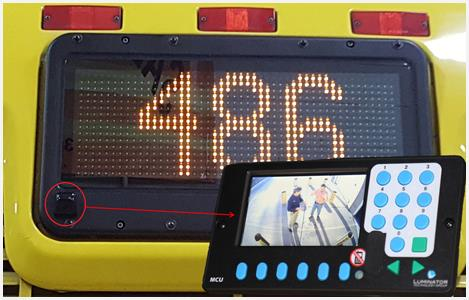 Camera integrated into rear sign.