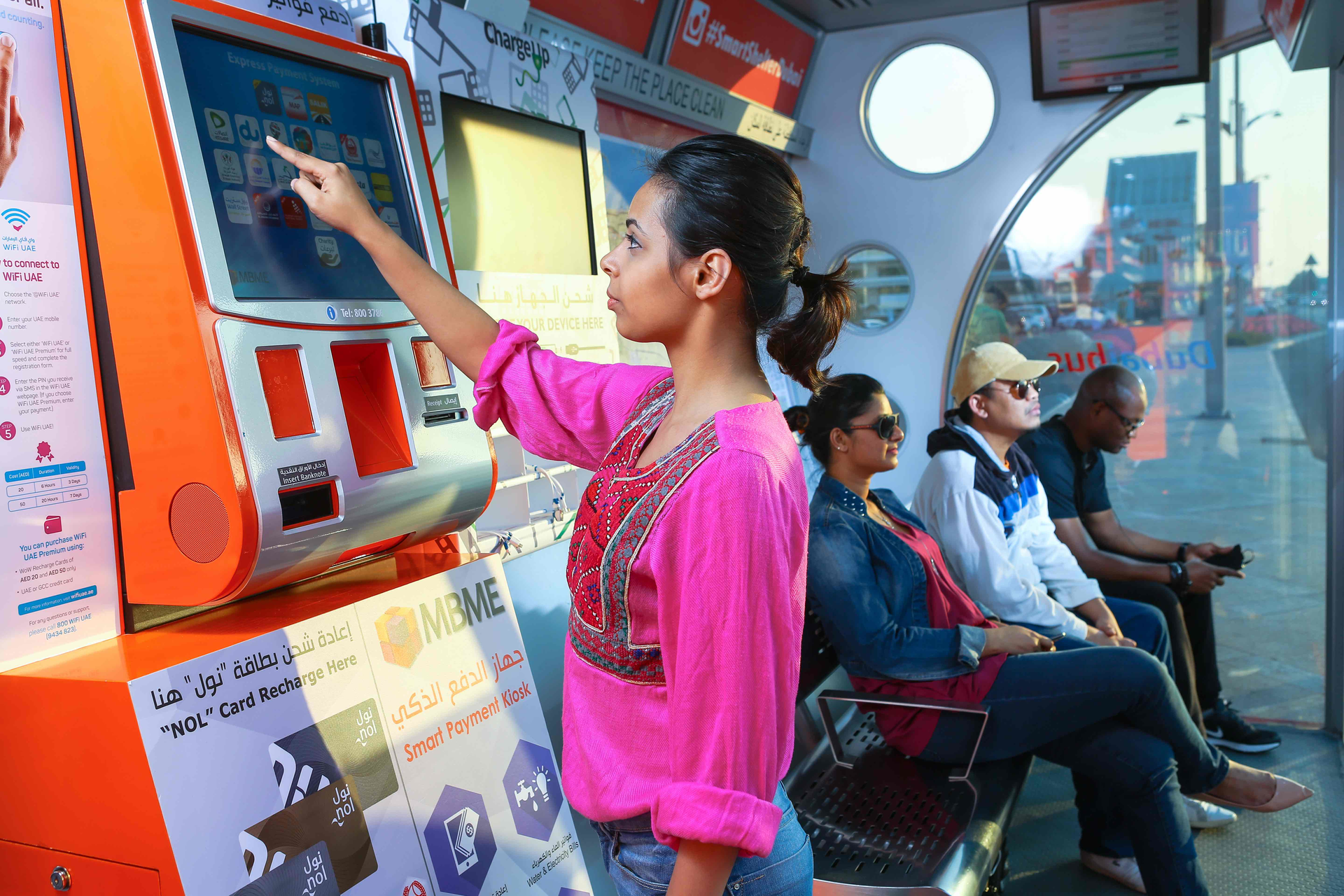 An RTA rider using the Smart Shelters service while waiting.